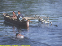 children in outrigger canoe