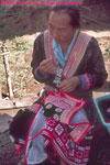 Hmong woman embroidering