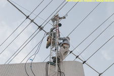 hauling the antenna up the tower