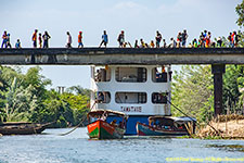 barge caught under bridge