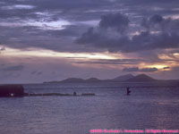 sunset over wreck in lagoon