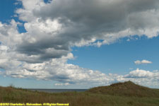 clouds over dunes