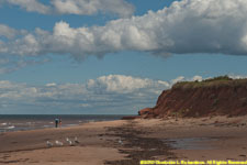 red beach, cliff, clouds