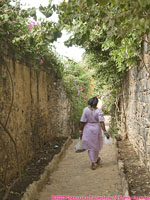 woman walking down alley