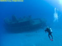 Charlotte approaching small wreck