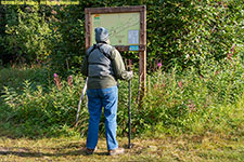 Charlotte looking at trail map sign