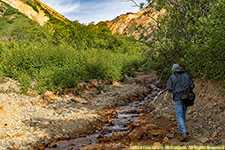 Paul hiking up stream