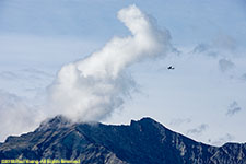 mountain, clouds, and bush plane